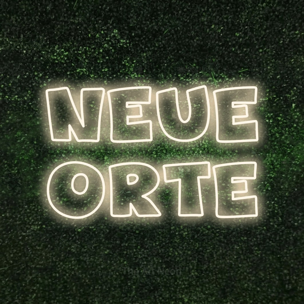 LED neon sign reading “neue orte”, arranged in 2 lines.