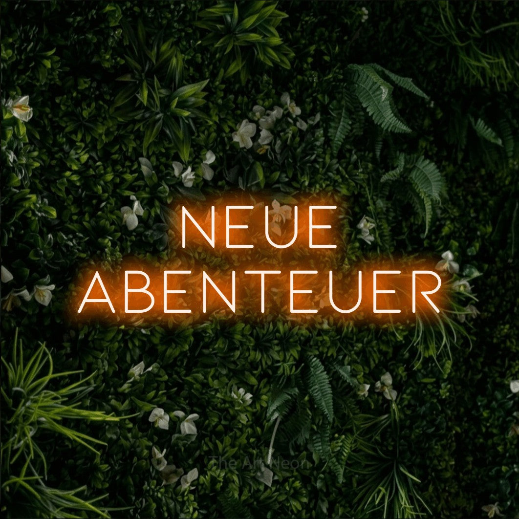 LED neon sign reading “Neue Abenteuer”, arranged in 2 lines.