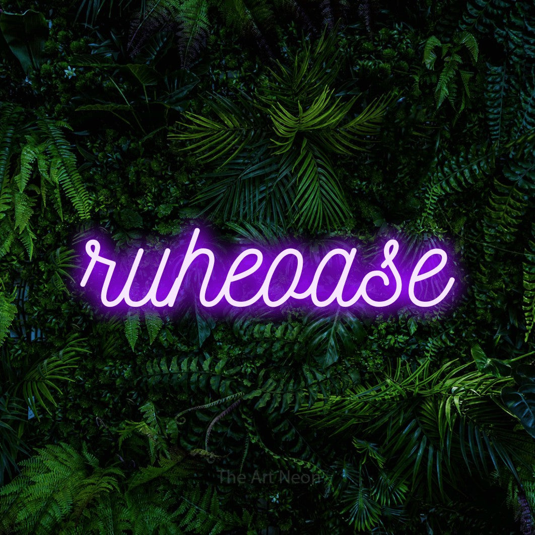 LED neon sign reading “ruheoase”, arranged in a single line.