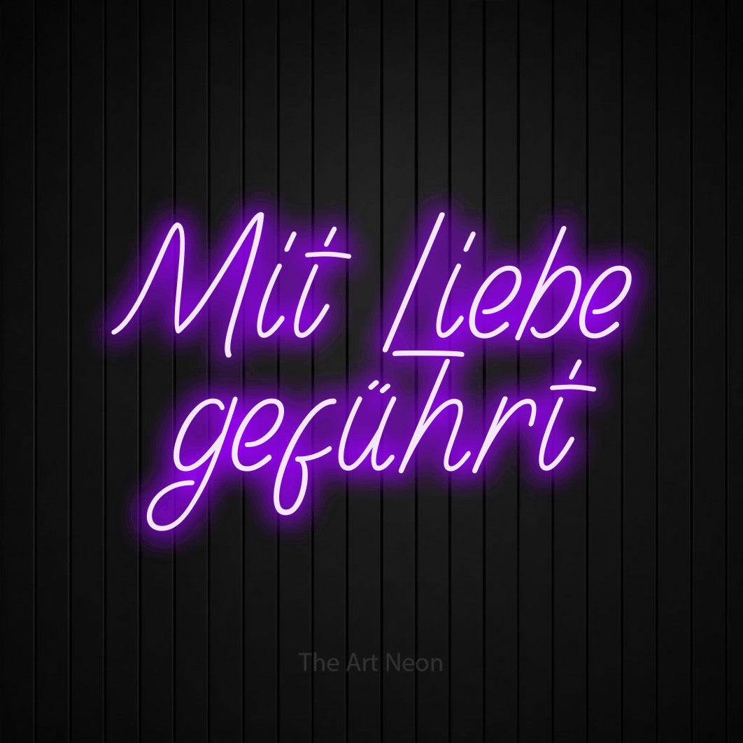 LED neon sign reading “Mit Liebe geführt”, arranged in 2 lines.