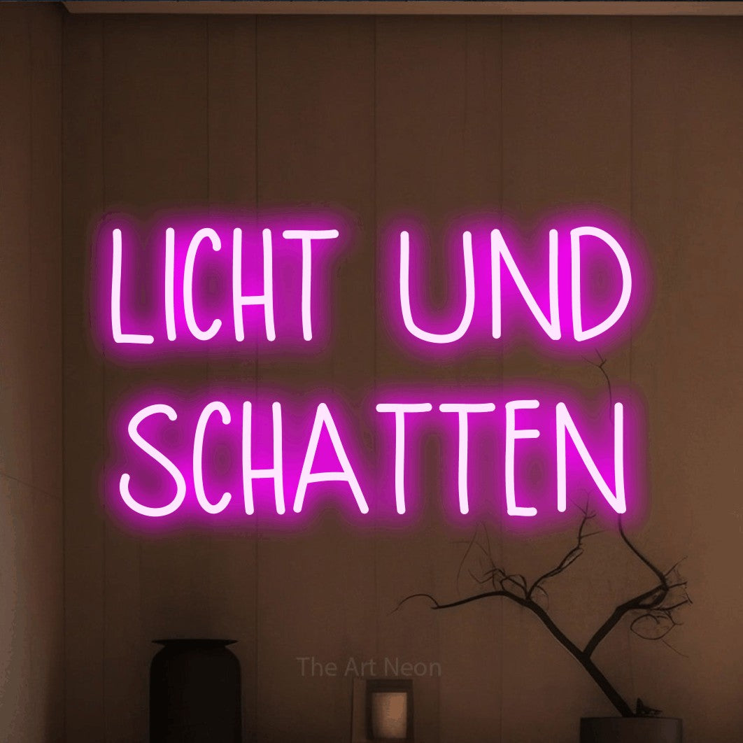LED neon sign reading “LICHT UND SCHATTEN”, arranged in 2 lines.
