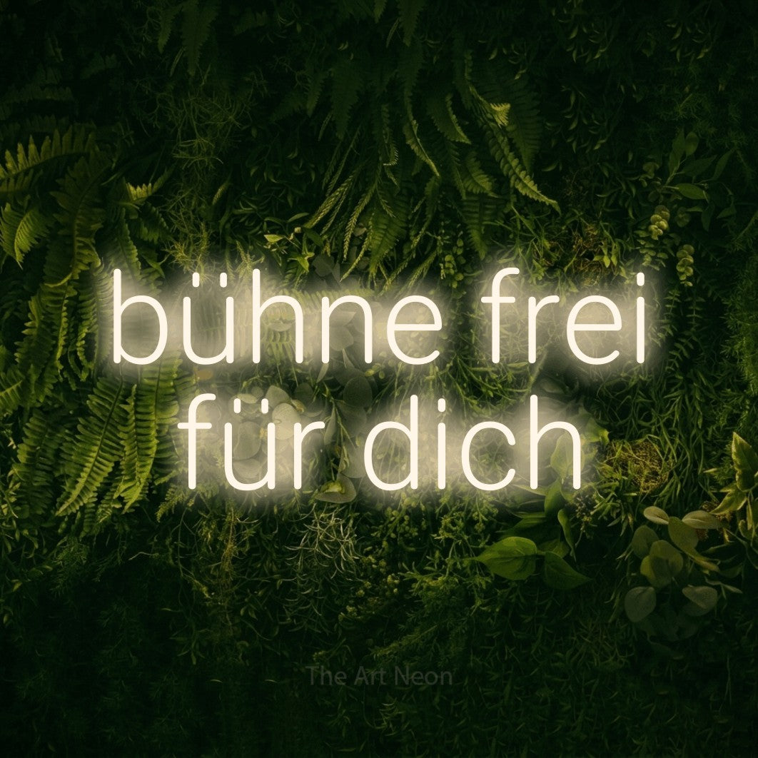 LED neon sign reading “bühne frei für dich”, arranged in 2 lines.