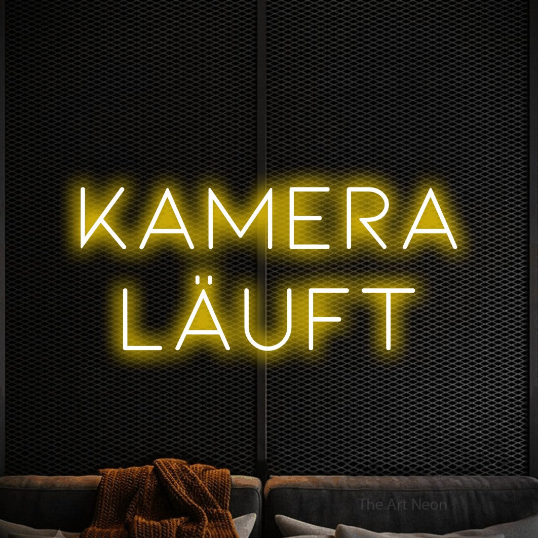 LED neon sign reading “kamera läuft”, arranged in 2 lines.