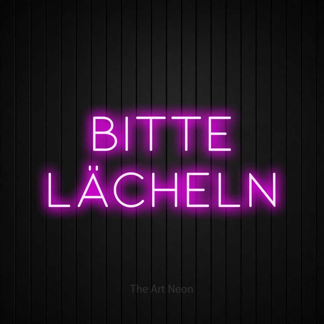 LED neon sign reading “bitte lächeln”, arranged in 2 lines.