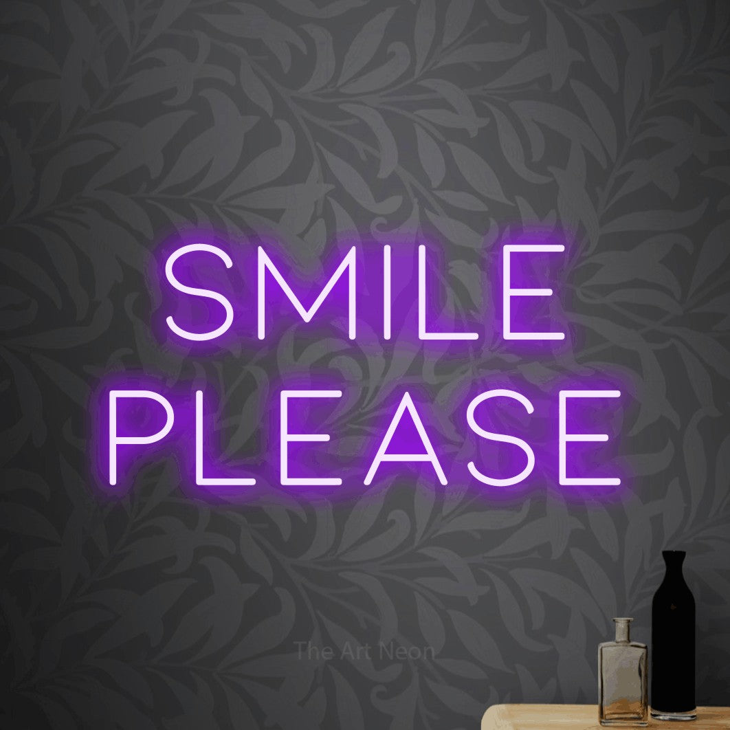 LED neon sign reading “Smile please”, arranged in 2 lines.