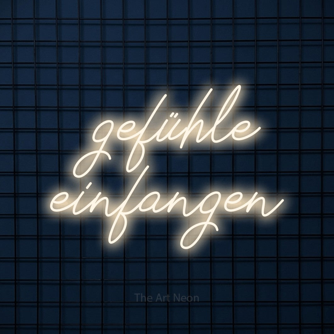LED neon sign reading “gefühle einfangen”, arranged in 2 lines.