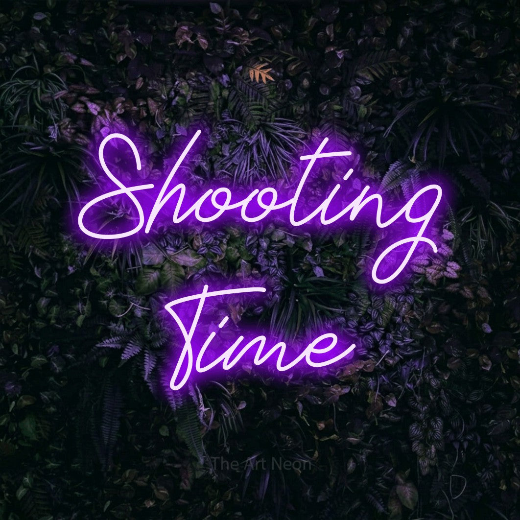 LED neon sign reading “Shooting Time”, arranged in 2 lines.