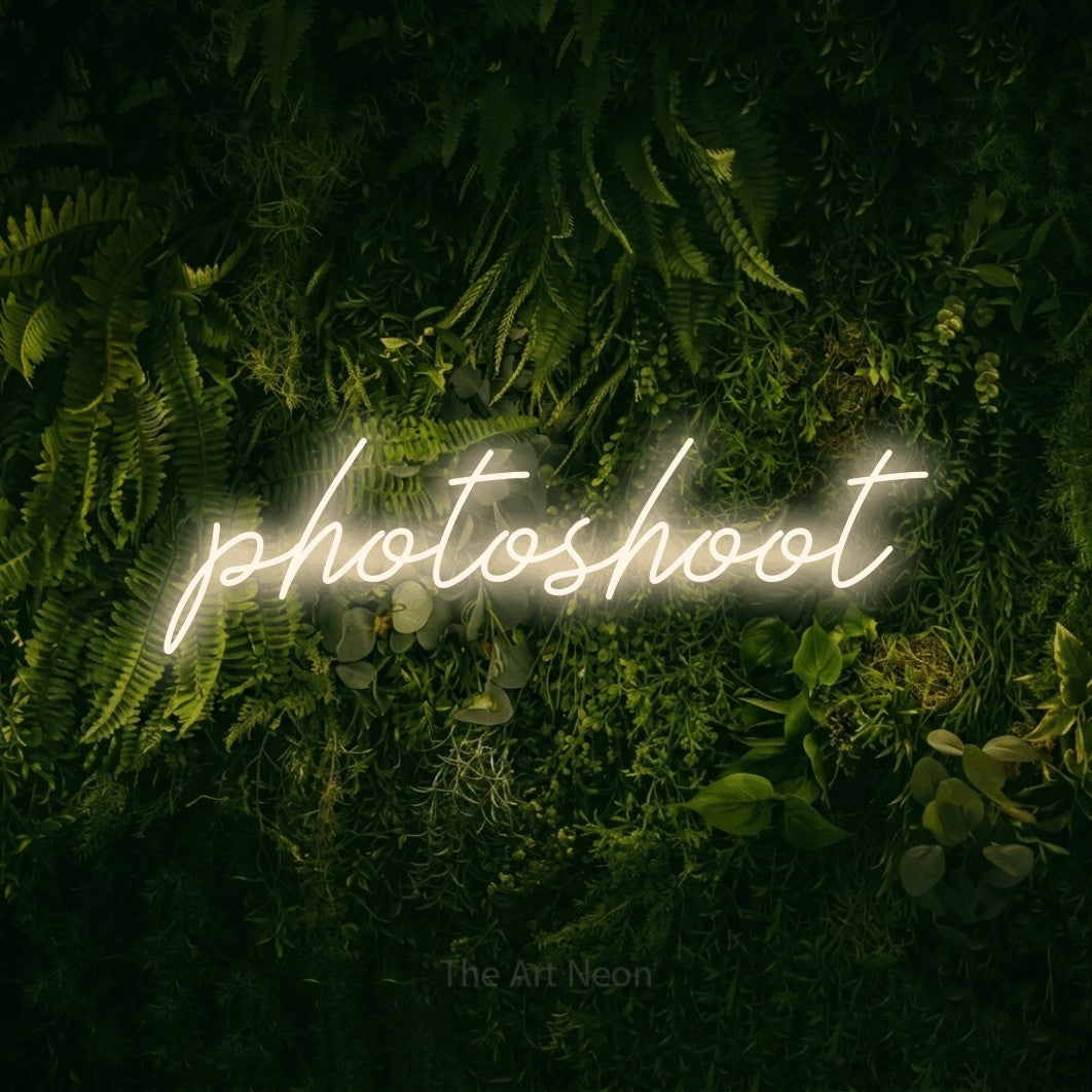 LED neon sign reading “photoshoot”, arranged in a single line.