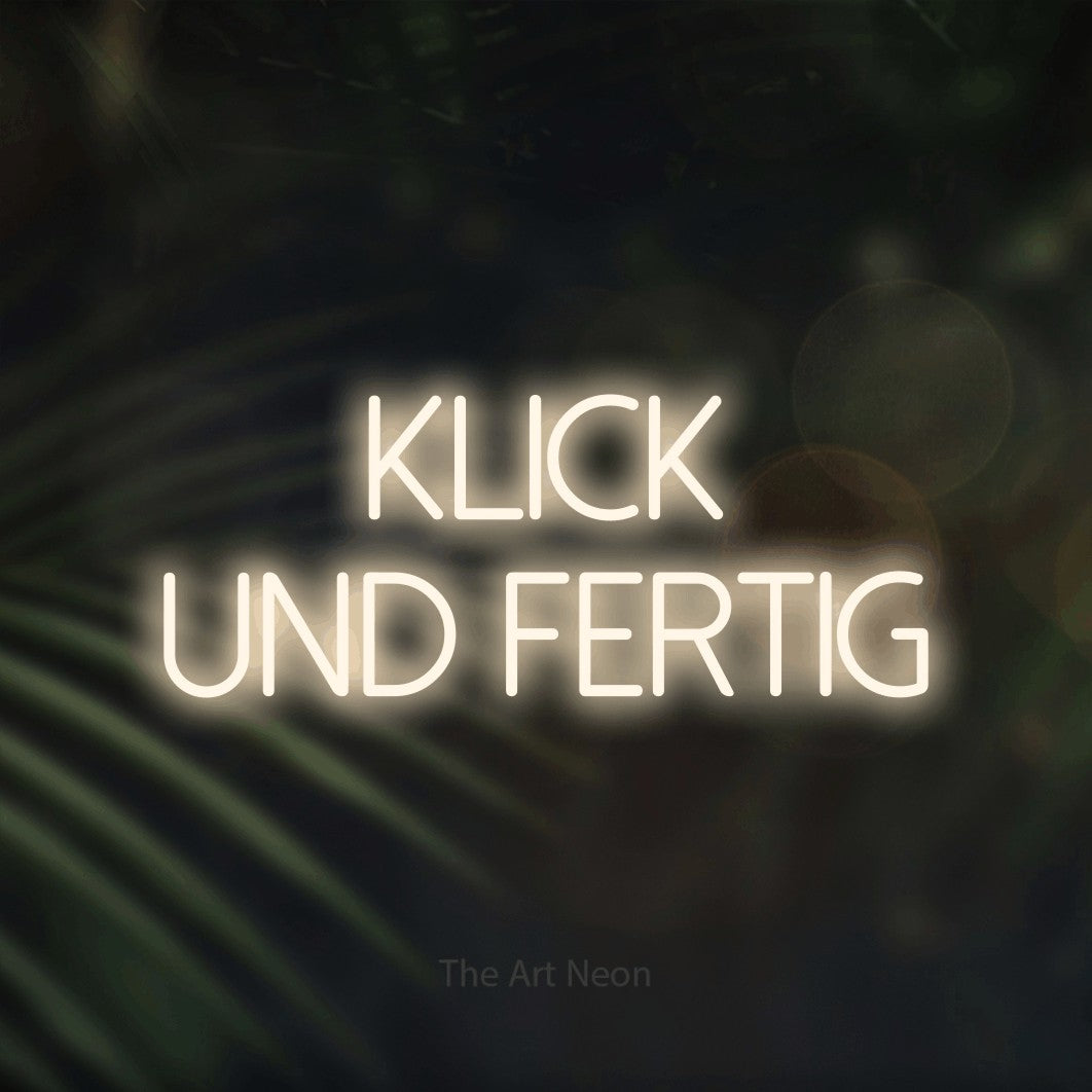 LED neon sign reading “Klick und fertig”, arranged in 2 lines.