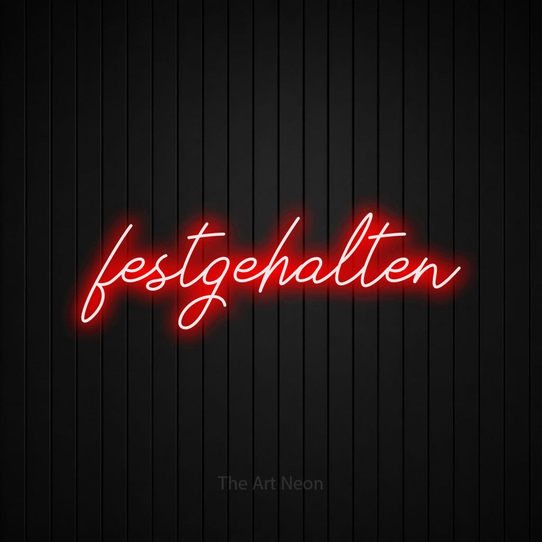 LED neon sign reading “festgehalten”, arranged in a single line.