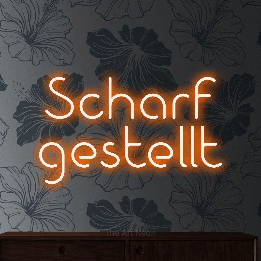 LED neon sign reading “Scharf gestellt”, arranged in 2 lines.