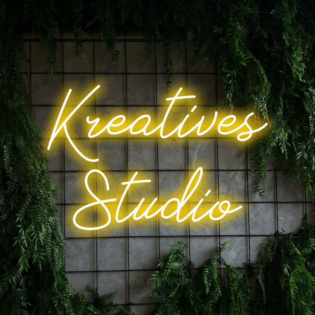 LED neon sign reading “Kreatives Studio”, arranged in 2 lines.