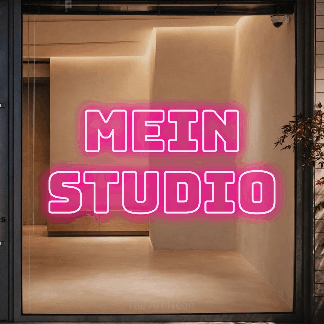 LED neon sign reading “mein STUDIO”, arranged in 2 lines.