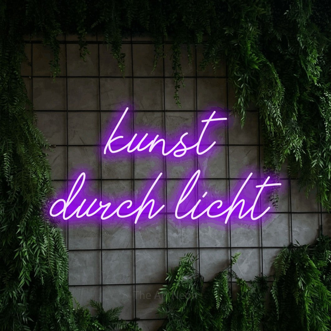 LED neon sign reading “kunst durch licht”, arranged in 2 lines.