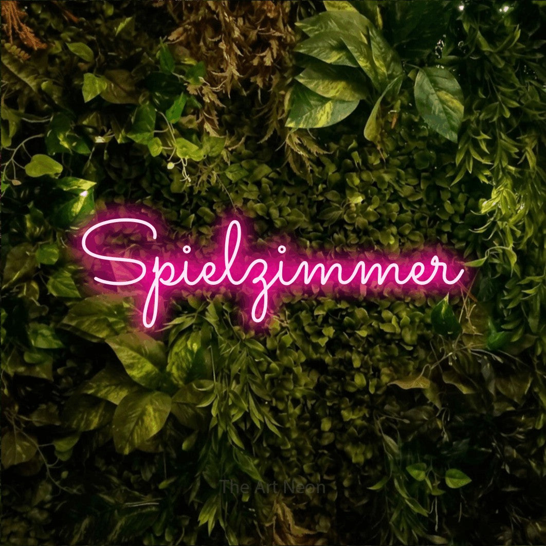 LED neon sign reading “Spielzimmer”, arranged in a single line.