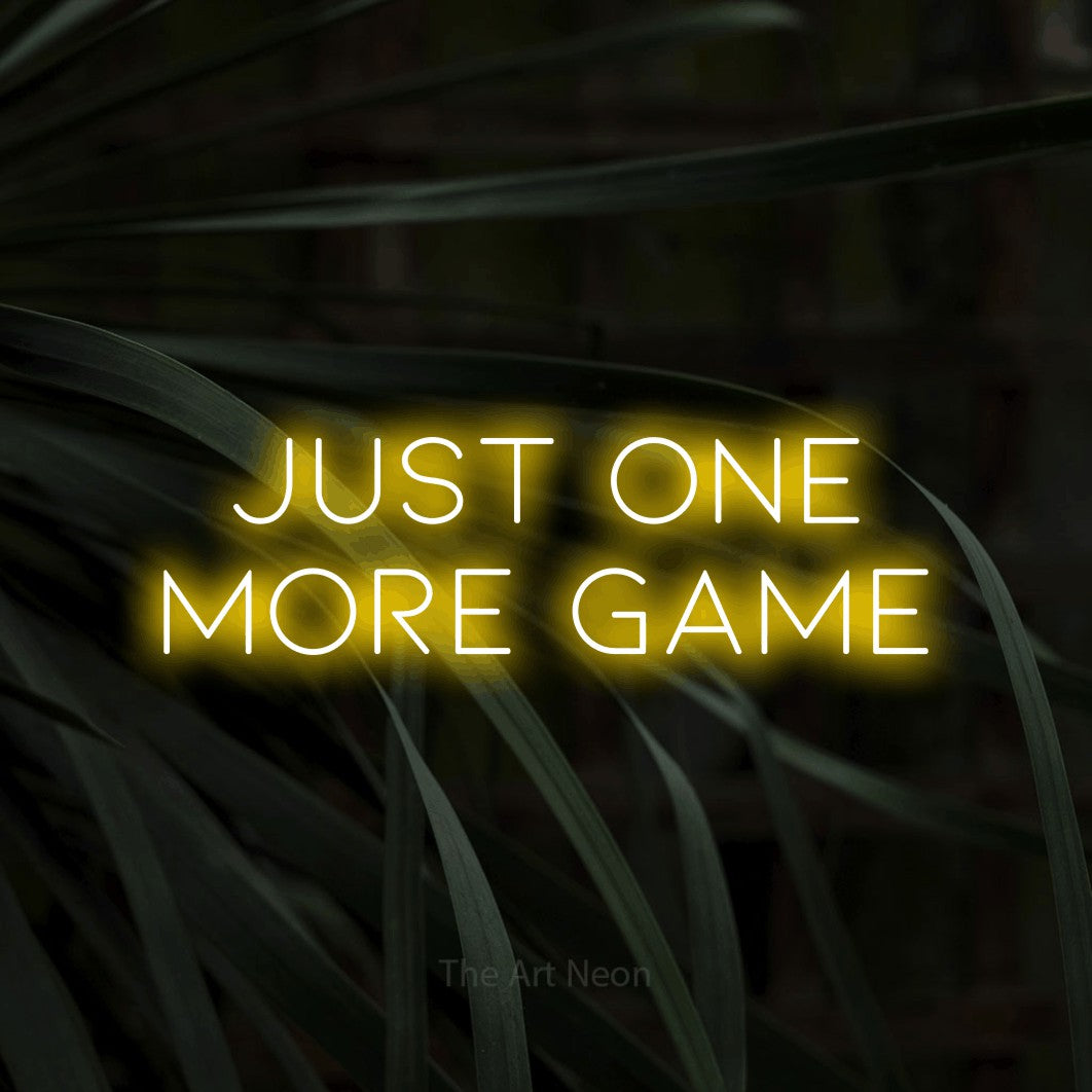 LED neon sign reading “JUST ONE MORE GAME”, arranged in 2 lines.