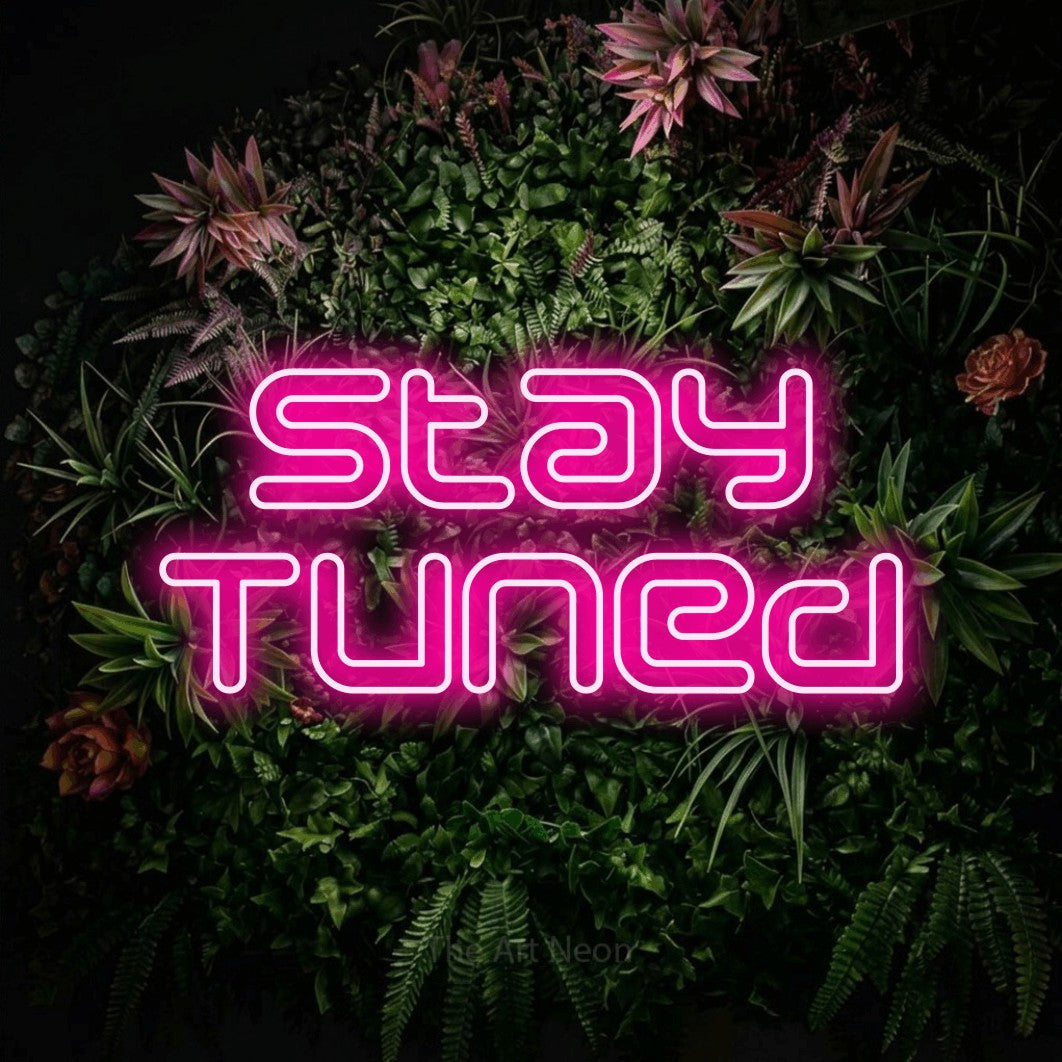 LED neon sign reading “Stay Tuned”, arranged in 2 lines.