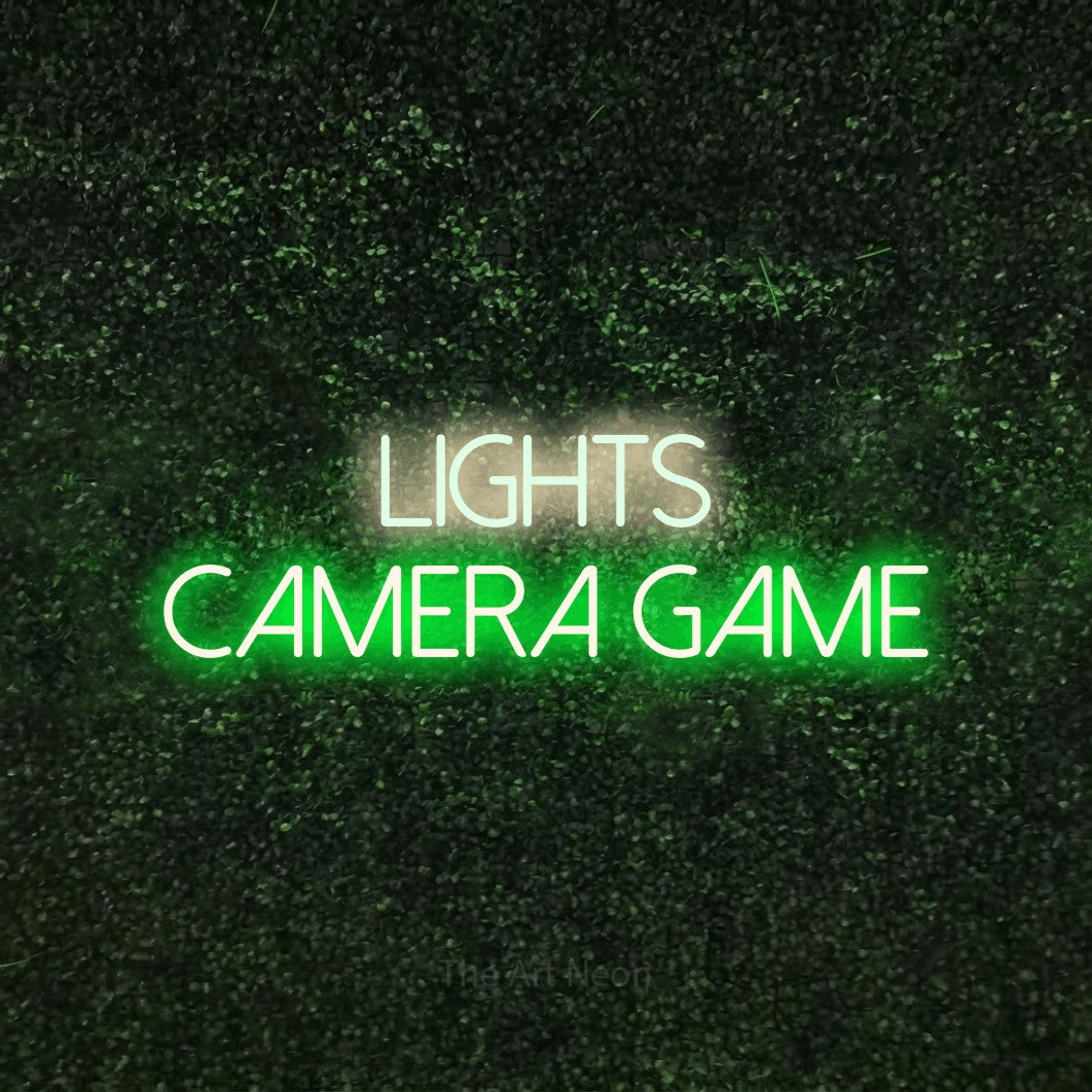 LED neon sign reading “Lights Camera Game”, arranged in 2 lines.
