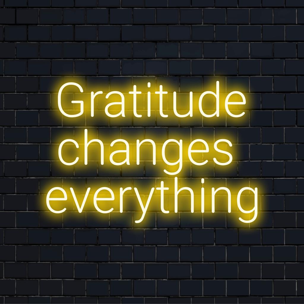 Custom LED neon sign reading Gratitude Changes Everything, perfect for adding inspirational decor to any space.