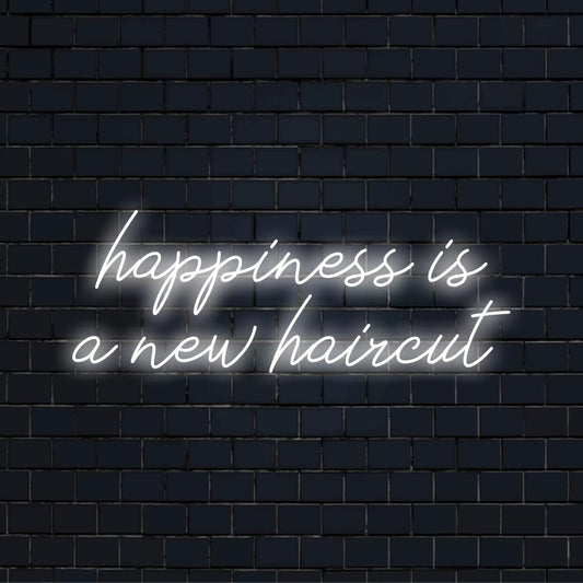 Bright, stylish custom LED neon sign stating Happiness Is A New Haircut, perfect for modern interior decor.