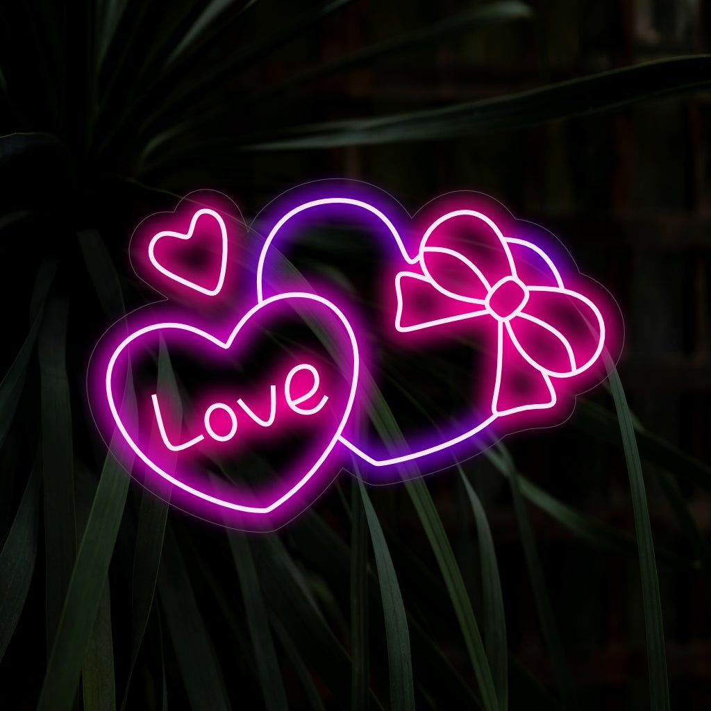 „Neonschild in Form einer herzförmigen Geschenkbox“ – Strahlt Liebe und Überraschung aus, perfekt für Geschenkläden, romantische Anlässe oder jeden Raum, der Gefühle von Wärme und Zuneigung vermitteln soll.
