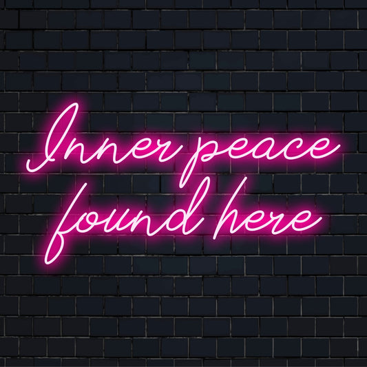 Custom-made LED neon sign reading Inner Peace Found Here, radiating with soothing light, perfect for tranquil decor ambiance.