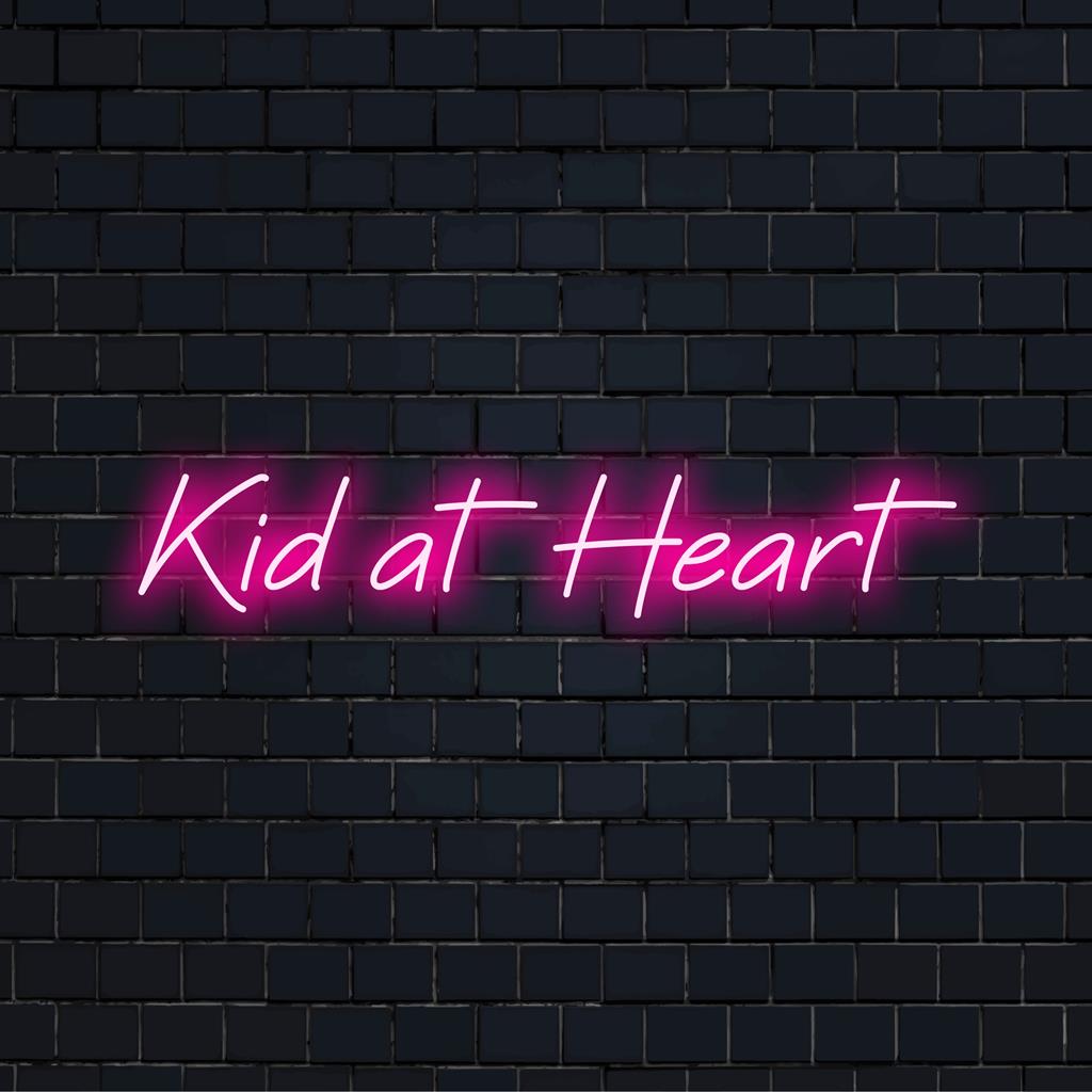 Vibrant Kid At Heart LED neon sign, pairing playful nostalgia with luminous art; perfect for unique wall decor.