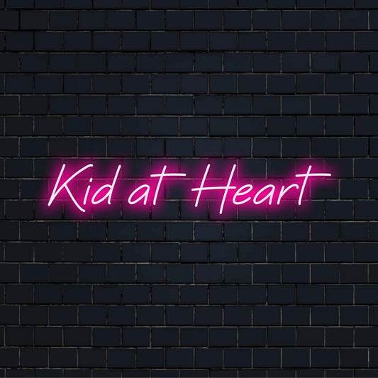 Vibrant Kid At Heart LED neon sign, pairing playful nostalgia with luminous art; perfect for unique wall decor.