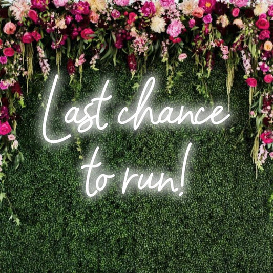 Custom made LED neon sign displaying Last Chance To Run in vibrant colors, perfect for eye-catching wall decor.