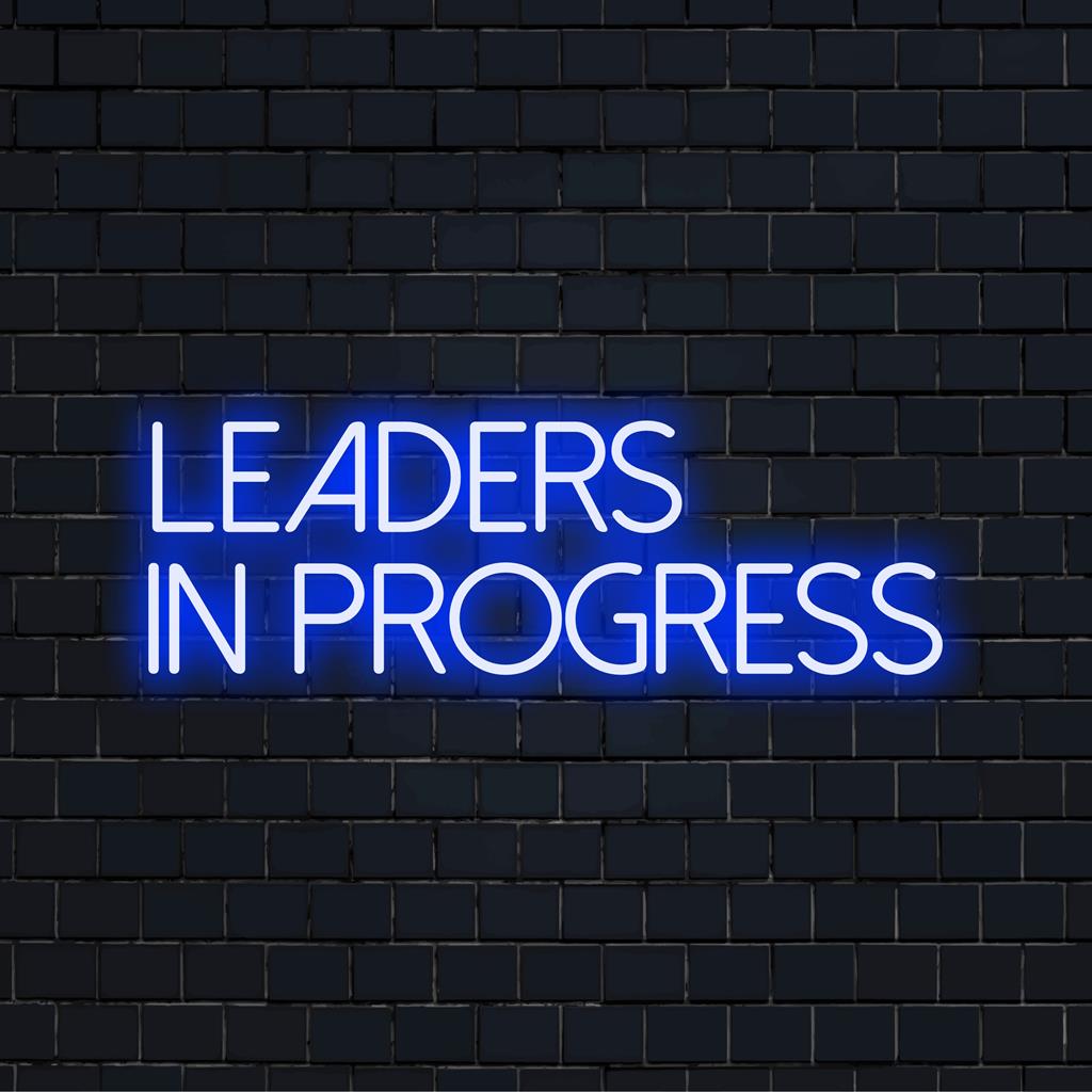 Custom made LED neon sign reading Leaders In Progress, ideal for wall art and personalized light decor.