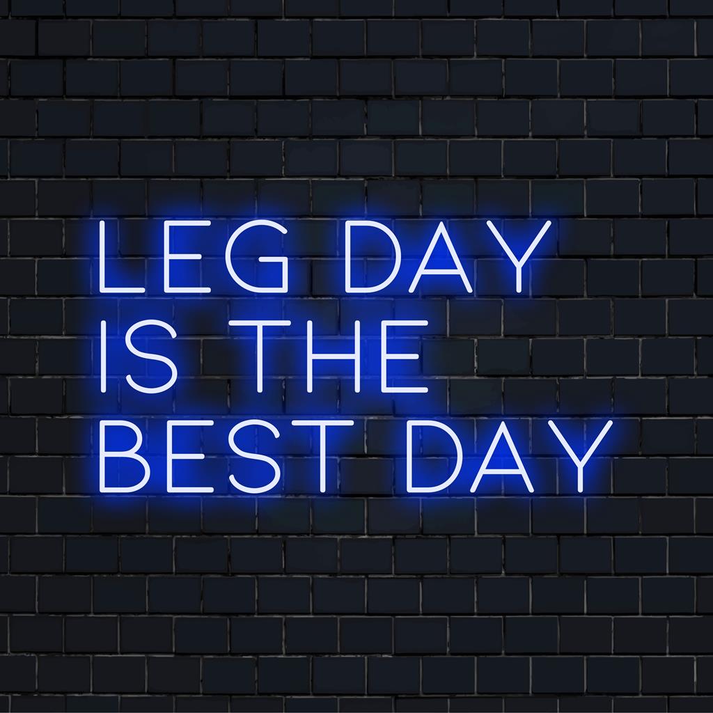 Custom LED neon sign reading Leg Day Is The Best Day in vibrant light, perfect gym decor for motivational ambiance.