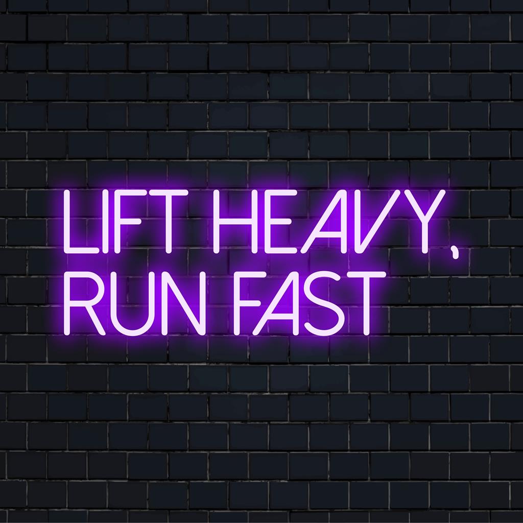 Custom LED neon sign saying 'Lift Heavy, Run Fast' in bold font; vibrant wall art for energizing fitness environments.