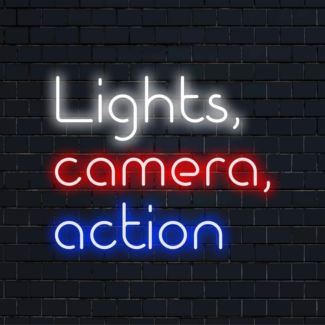 LED neon sign with the phrase Lights, Camera, Action illuminating in vibrant colors, perfect for decorating any space.