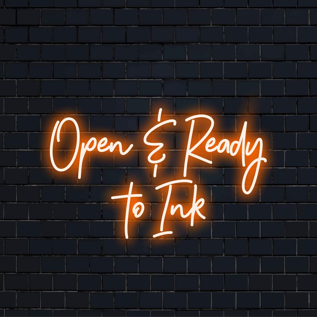 LED neon sign featuring the inviting message Open Ready To Ink in bright, bold letters, perfect for tattoo studios or kiosk displays.