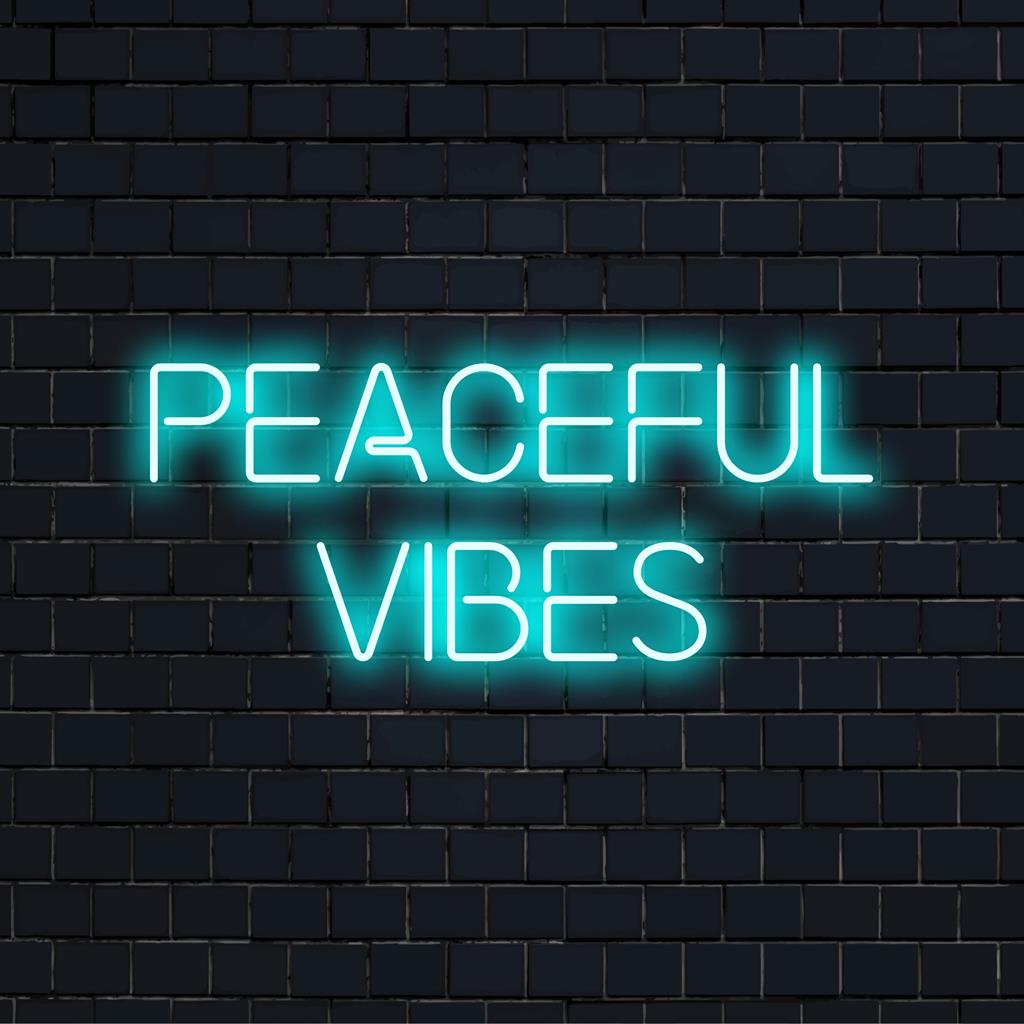 Vibrant custom LED neon sign stating Peaceful Vibes, perfect for adding a serene touch to any space with bespoke neon art.