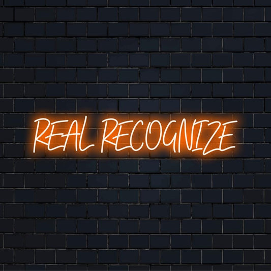 Vibrant, custom LED neon sign with the phrase Real Recognize Real; perfect for illuminating any space with dazzling light decor.