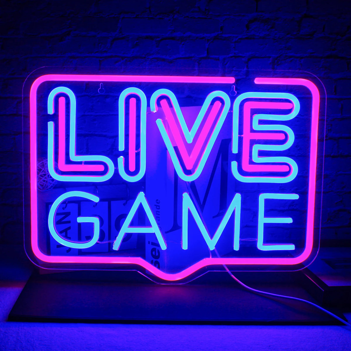 The image features a vibrant and colorful "Live Game" LED neon sign, crafted with precision to showcase its handmade quality.