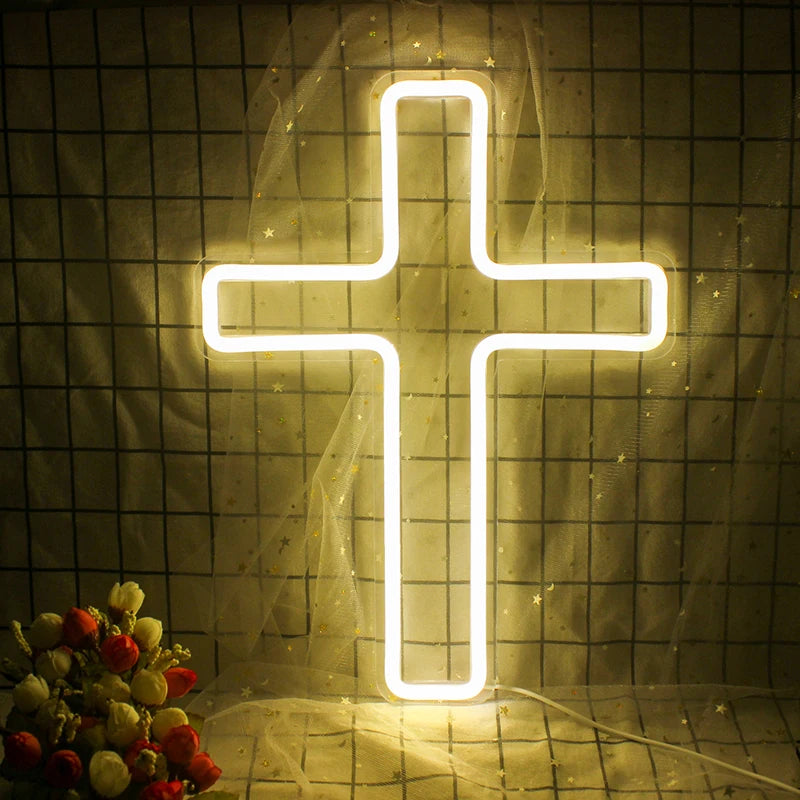 Das Bild zeigt ein hell leuchtendes LED-Neonschild in Form eines Kreuzes.