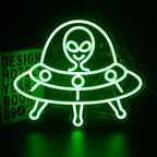 The image features a glowing LED neon sign in the shape of a friendly alien face.