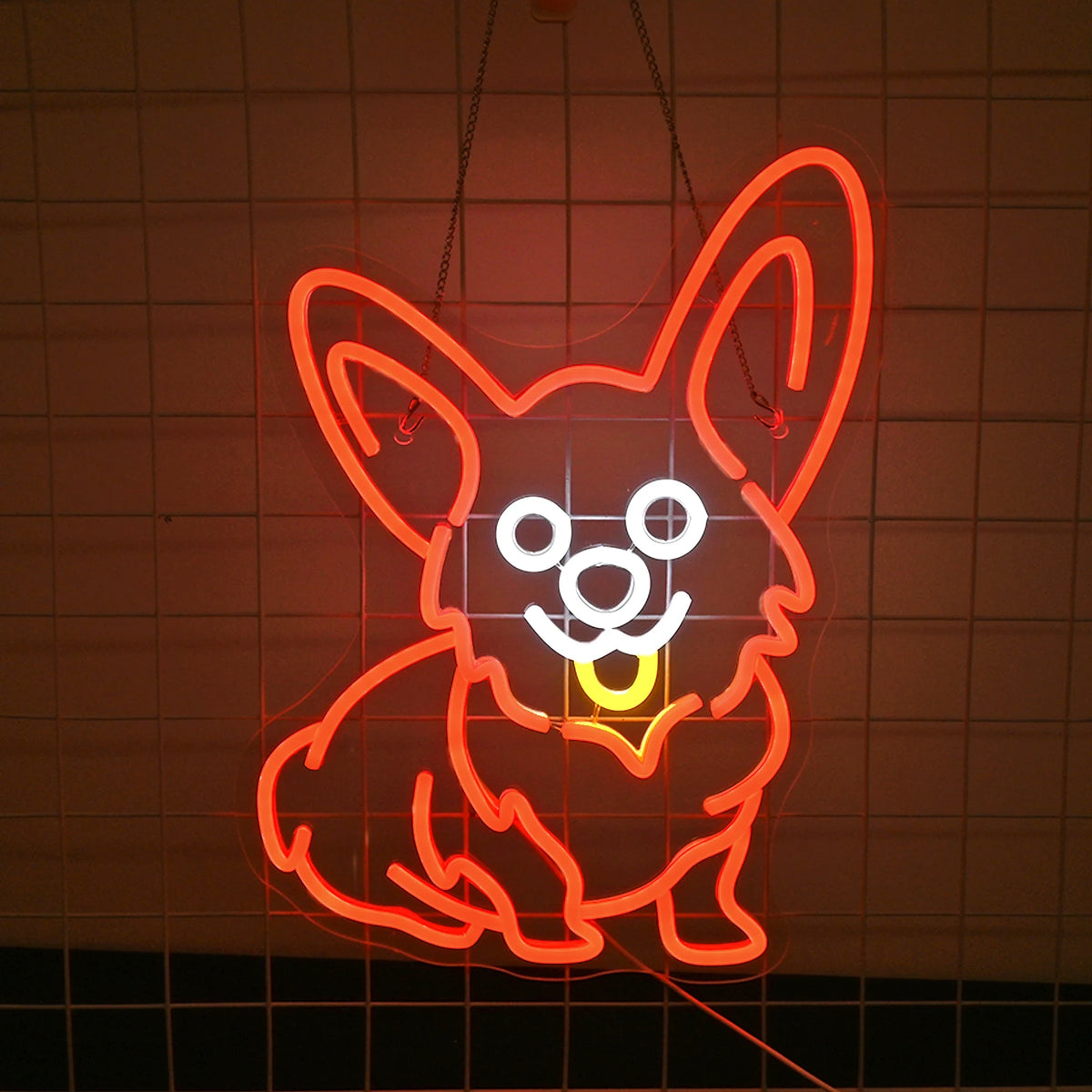 Ein helles und leuchtend rotes LED-Neonschild, das die Silhouette eines Corgi-Hundes darstellt.