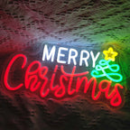 Das Bild zeigt ein lebendiges, handgefertigtes LED-Neonschild, auf dem in eleganter, fließender Schrift „Frohe Weihnachten“ steht.