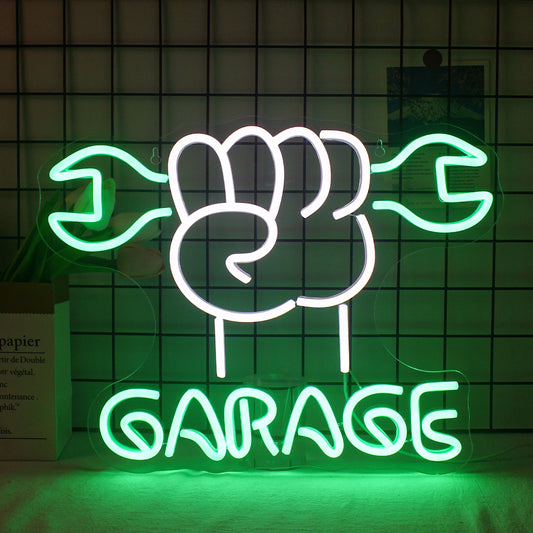 A vibrant LED neon sign with the word "Garage" illuminated in bold, eye-catching letters.