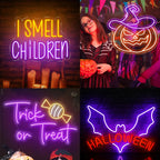 The image displays a vibrant LED neon sign that reads "Trick or Treat" in playful, stylized lettering.