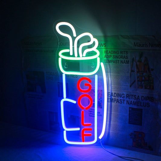 The image shows a vibrant LED neon sign in the shape of the word "GOLF" illuminated against a dark background.