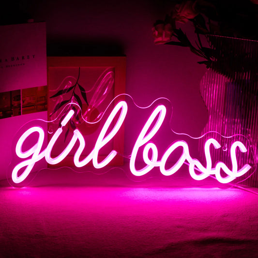 The image displays a vibrant, handmade LED neon sign that spells out "Girl Boss" in a stylish, cursive font.