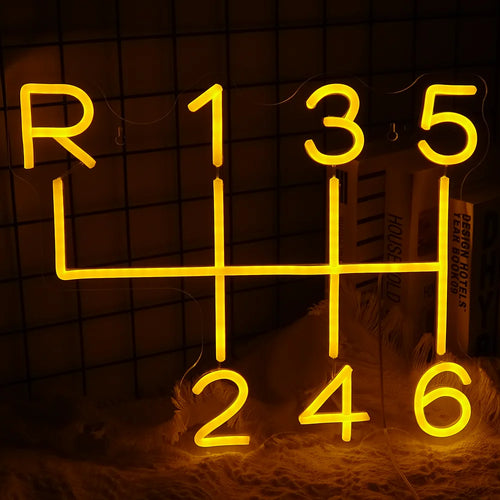 Das Bild zeigt ein handgefertigtes LED-Neonschild in Form eines Autogetriebes.