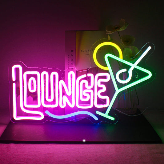 A vibrant LED neon sign reading "Cocktails Lounge" in a stylish script font.