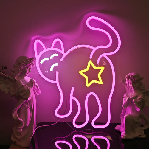 Das Bild zeigt ein katzenförmiges LED-Neonschild, das ein warmes, gelbes Licht ausstrahlt.