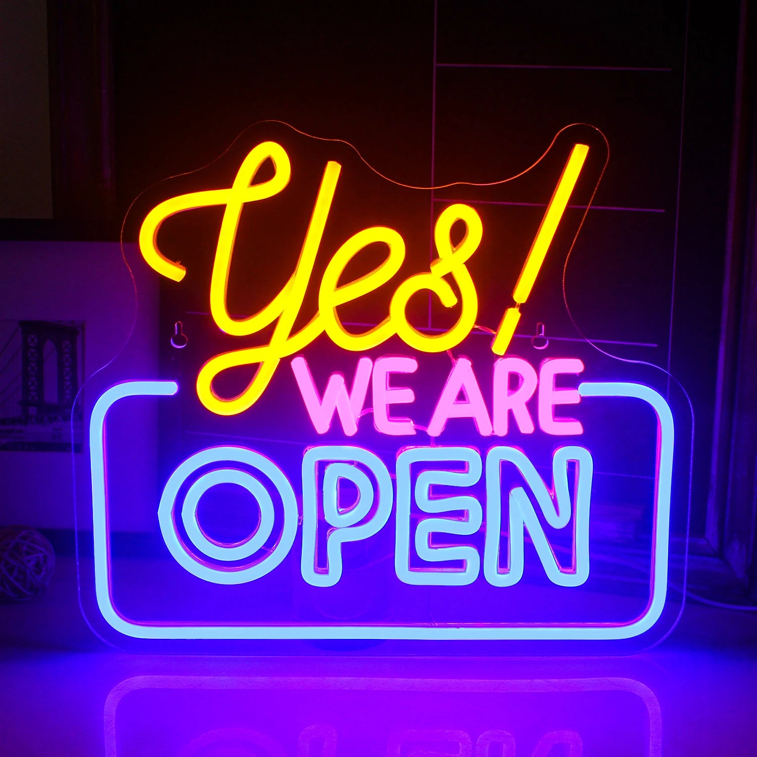 The image features a vibrant LED neon sign displaying the word "Open" in a bold and eye-catching script.