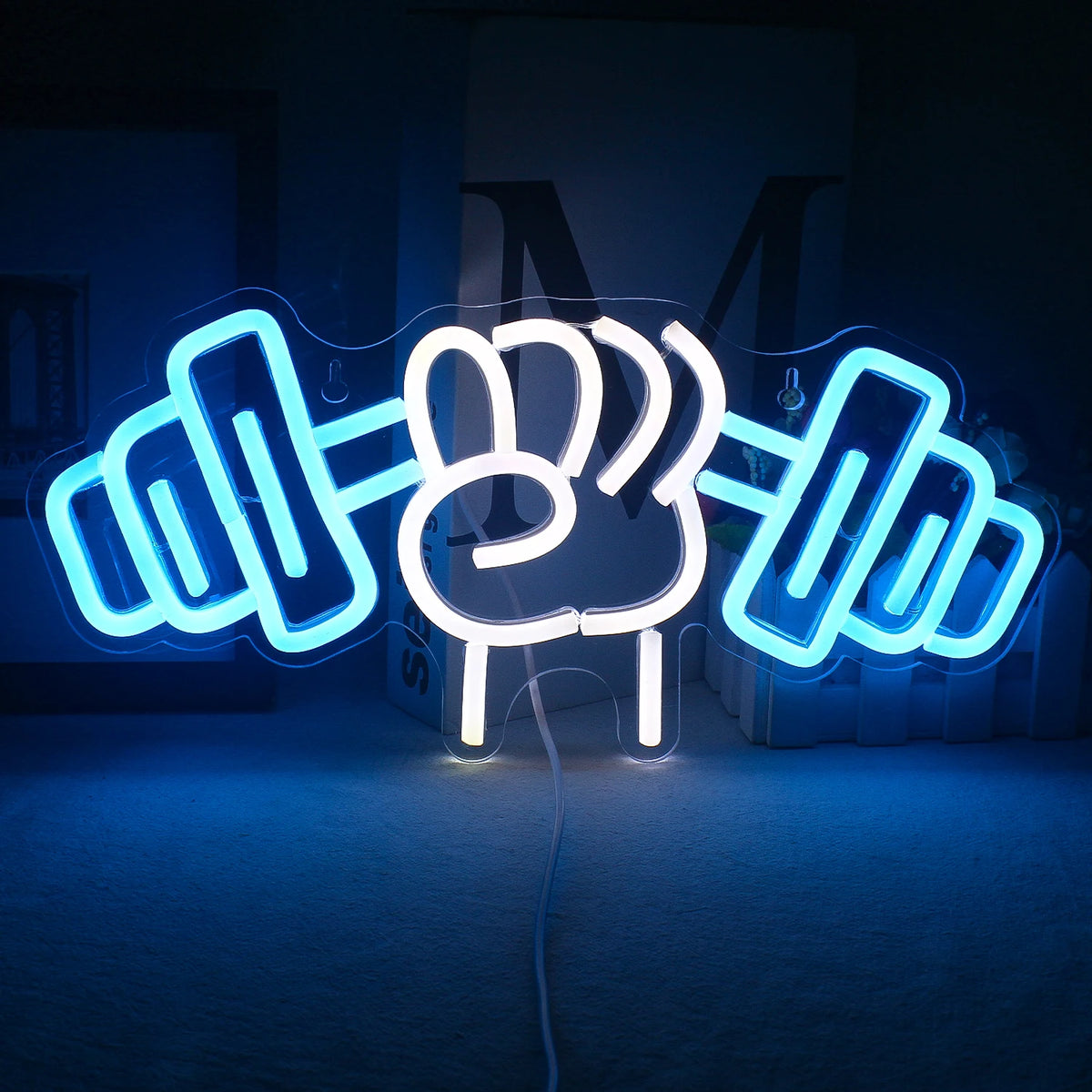 The image features a vibrant LED neon sign designed in the shape of a barbell weightlifting motif.
